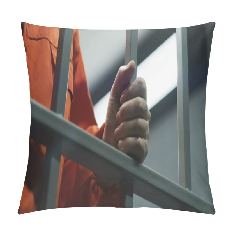 Personality  Close Up Of Prisoner In Orange Uniform Holding Metal Bars, Standing In Prison Cell. Guilty Criminal Or Killer Serves Imprisonment Term For Crime. Inmate In Jail Or Detention Center. Justice System. Pillow Covers