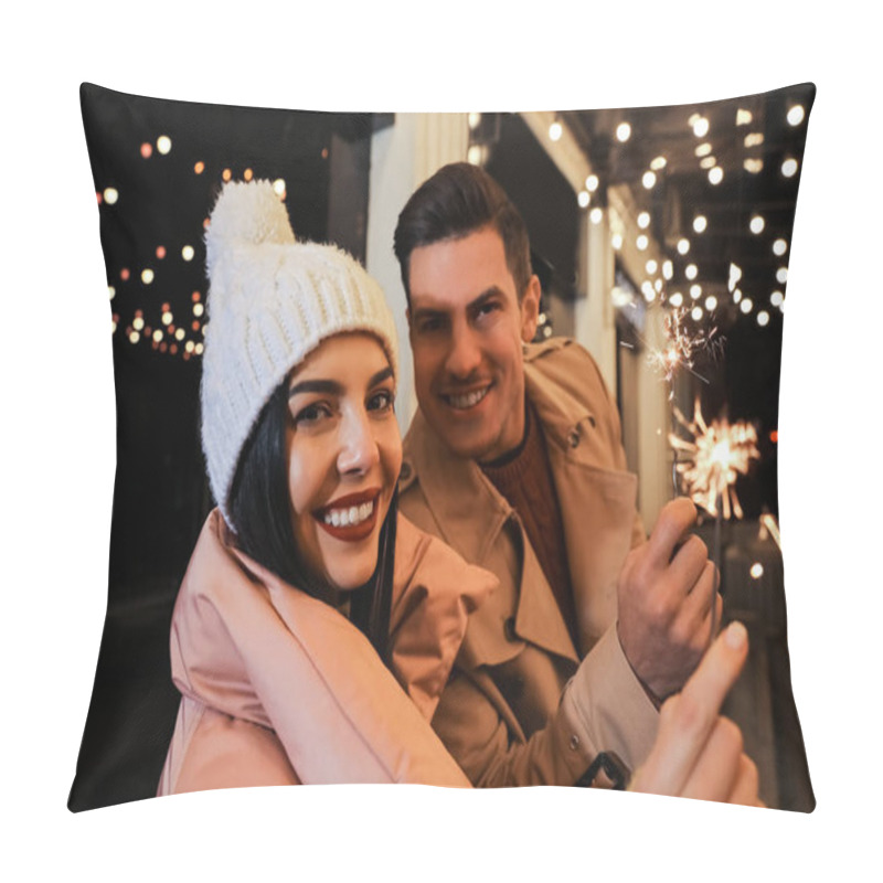 Personality  Couple In Warm Clothes Holding Burning Sparklers Near Building Pillow Covers