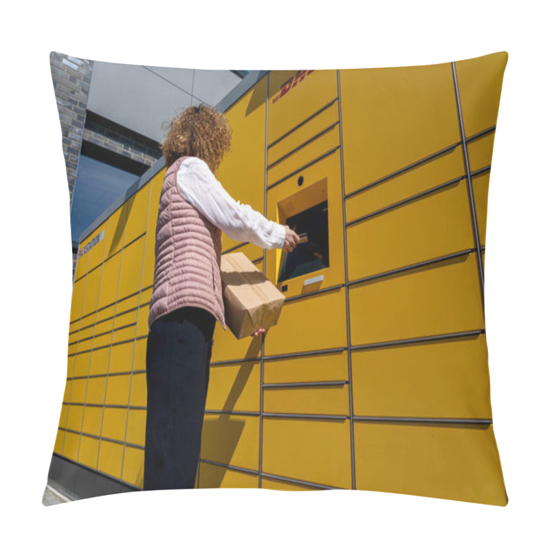 Personality  A Woman Sends And Receives A Mail Item At The Typical Yellow German Packing Stations Of DHL Pillow Covers