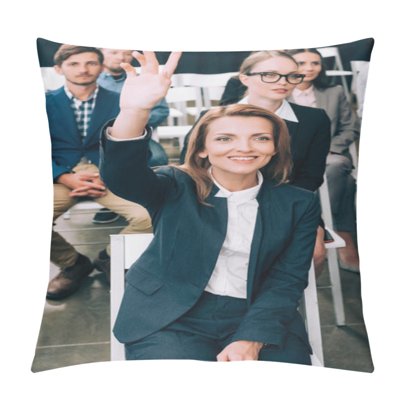 Personality  Smiling Businesswoman With Hand Up Want To Ask Question During Business Seminar In Conference Hall Pillow Covers