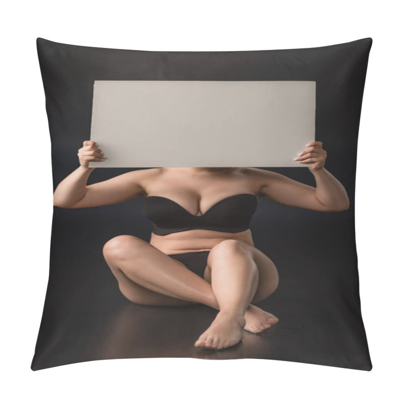 Personality  Front View Of Plus Size Model Covering Face With Blank Placard And Sitting On Black Background Pillow Covers