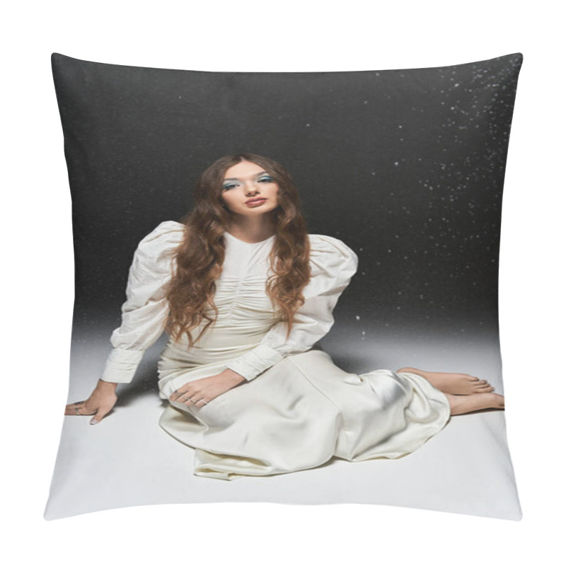 Personality  A Young Woman Sits Gracefully In A White Dress As Shimmer Cascades Around Her Amidst Dark Hues. Pillow Covers