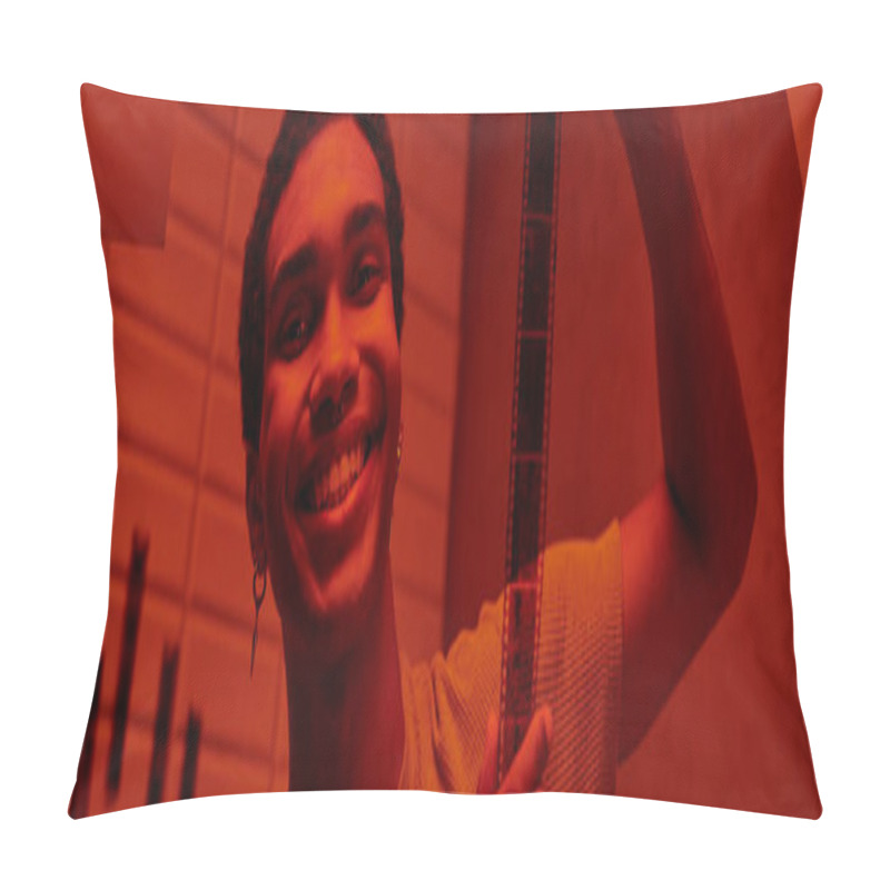 Personality  Cheerful African American Man Hanging Freshly Developed Film Strip  In A Red-lit Darkroom, Banner Pillow Covers