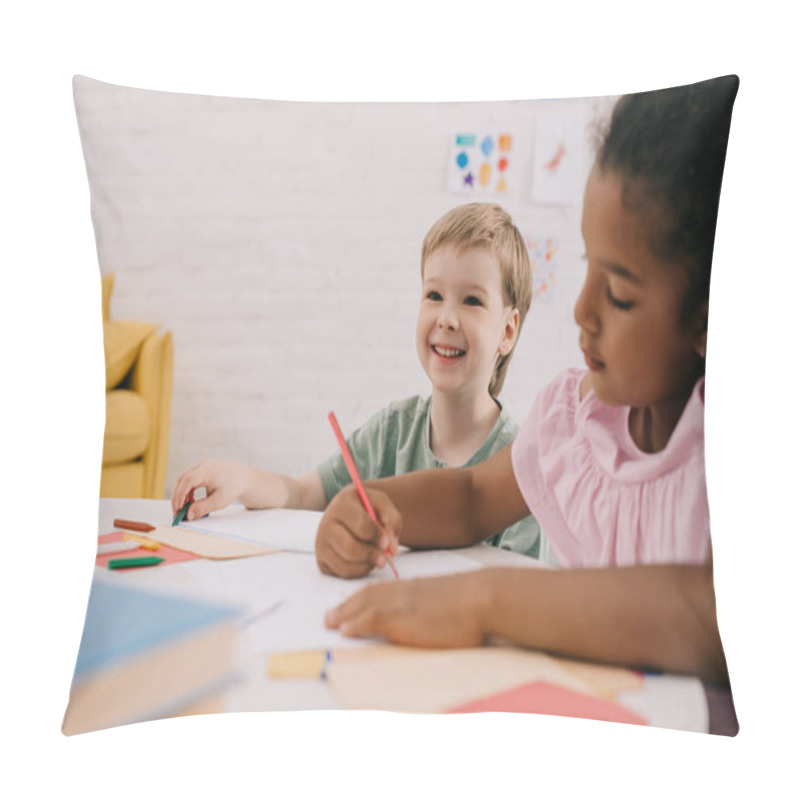 Personality  Selective Focus Of Multicultural Preschoolers At Table With Papers And Pencils In Classroom Pillow Covers