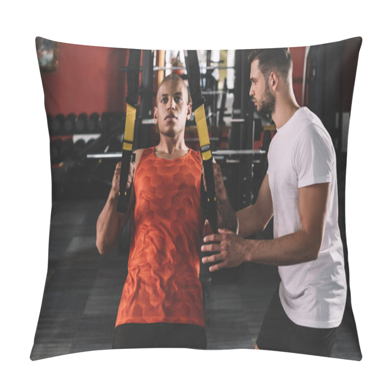 Personality  Attentive Trainer Supporting Young African American Athlete Pulling Up On Suspension Trainer Pillow Covers