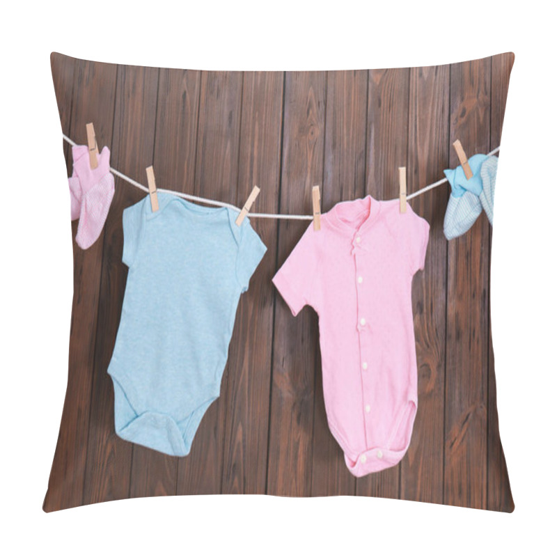 Personality  Children's Clothes On Laundry Line Against Wooden Background Pillow Covers