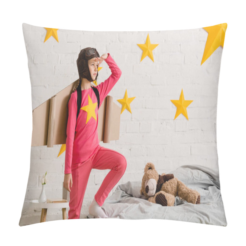 Personality  Confident Child With Cardboard Wings Looking Away While Standing In Bedroom Pillow Covers