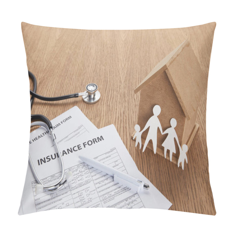 Personality  Close-up View Of Insurance Form, Insurance Health Claim Form, Pen, Stethoscope, House Model And Paper Cut Family On Wooden Table Pillow Covers