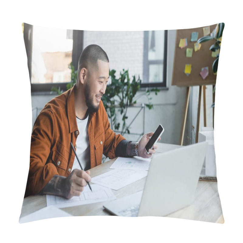 Personality  Smiling Asian Architect With Mobile Phone Drawing Blueprint Near Blurred Laptop And House Models Pillow Covers