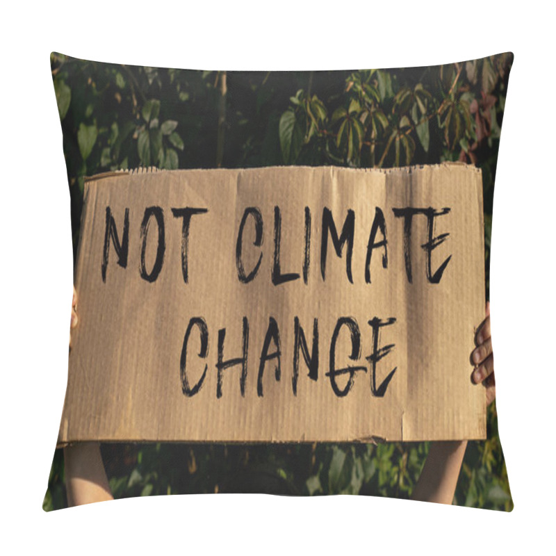 Personality  A Poster With The Words WE NEED A CHANGE In The Hands Of A Young Girl Against A Background Of Green Foliage. Pillow Covers