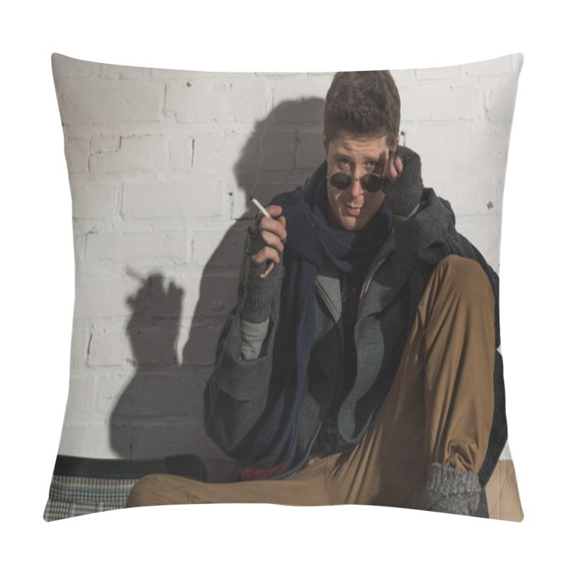 Personality  Homeless Man In Dark Glasses Smoking While Sitting By White Brick Wall  Pillow Covers