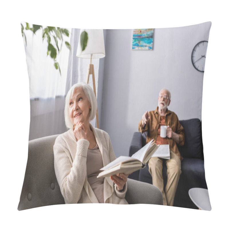 Personality  Senior Man Pointing With Finger While Smiling Wife Holding Book And Looking Away Pillow Covers