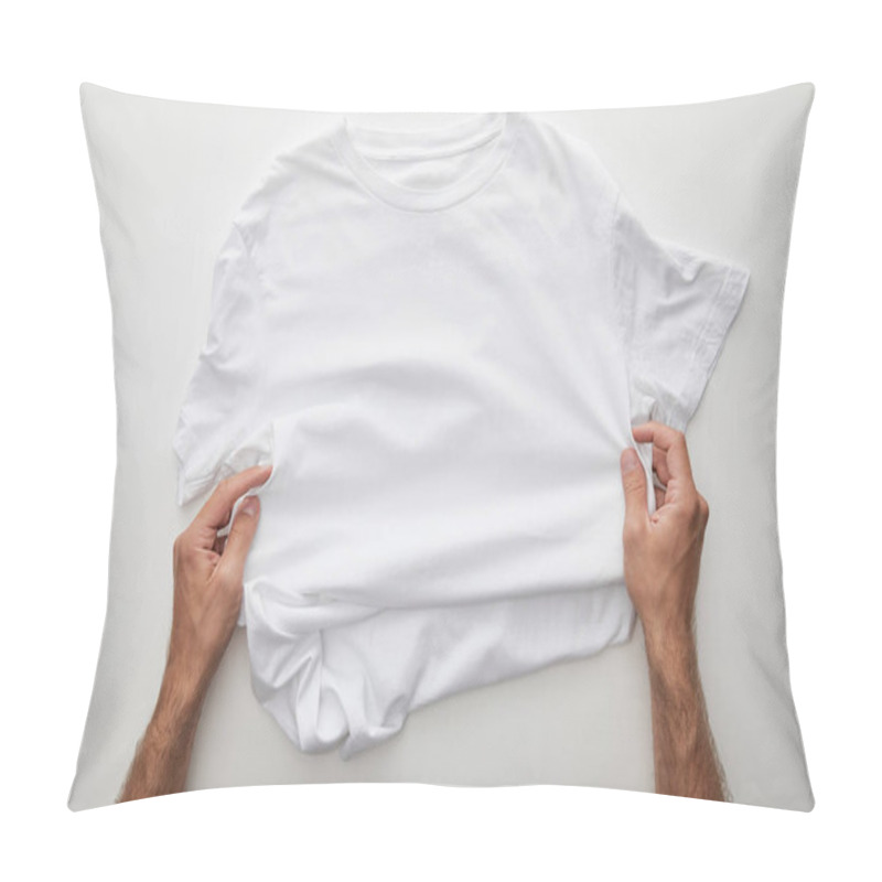 Personality  Cropped View Of Man Holding Plain T-shirt On White Background Pillow Covers