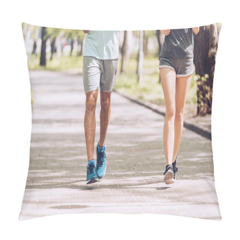 Personality  Cropped Shot Of Sportsman And Sportswoman Running Along Walkway In Park Pillow Covers