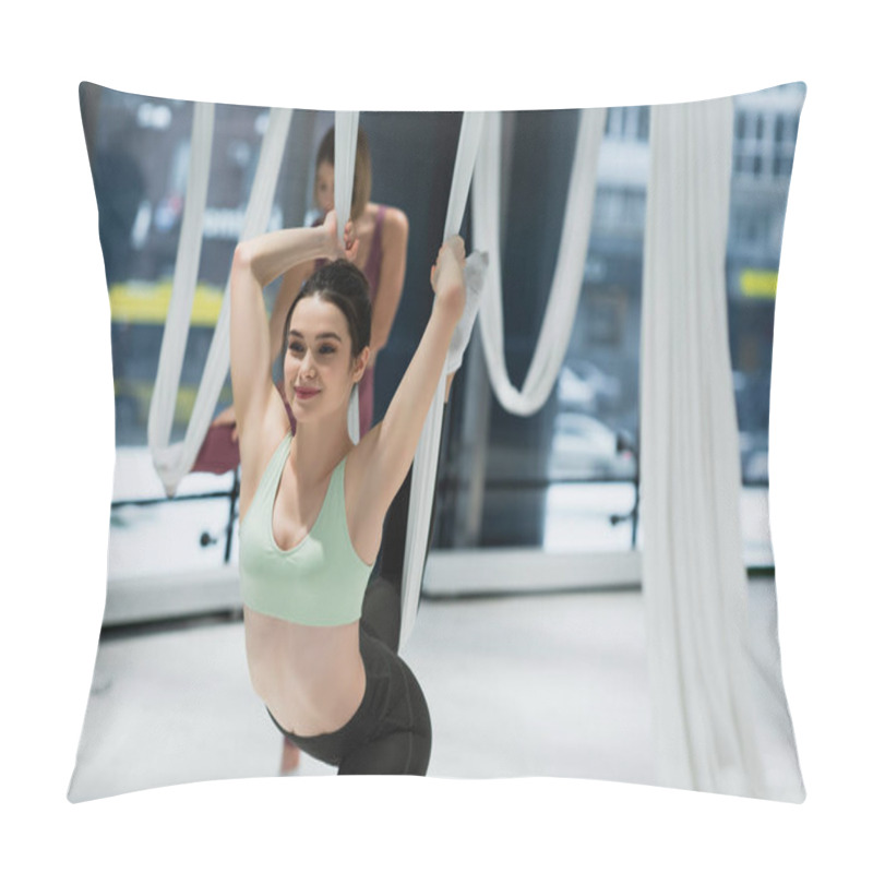 Personality  Cheerful Woman Stretching With Aerial Yoga Hammock On Blurred Background Pillow Covers