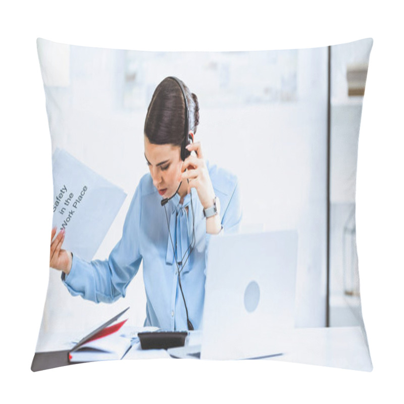 Personality  Young Call Center Operator Holding Instruction Of Safety In Workplace Near Laptop In Office Pillow Covers