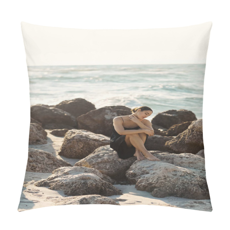 Personality  A Young Woman Sits On A Large Rock On Miami Beach, Wearing A Black Sundress Pillow Covers