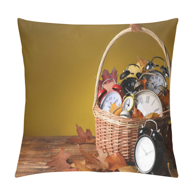 Personality  Alarm Clocks And Dry Leaves In Wicker Basket On Wooden Table Against Olive Background, Space For Text Pillow Covers