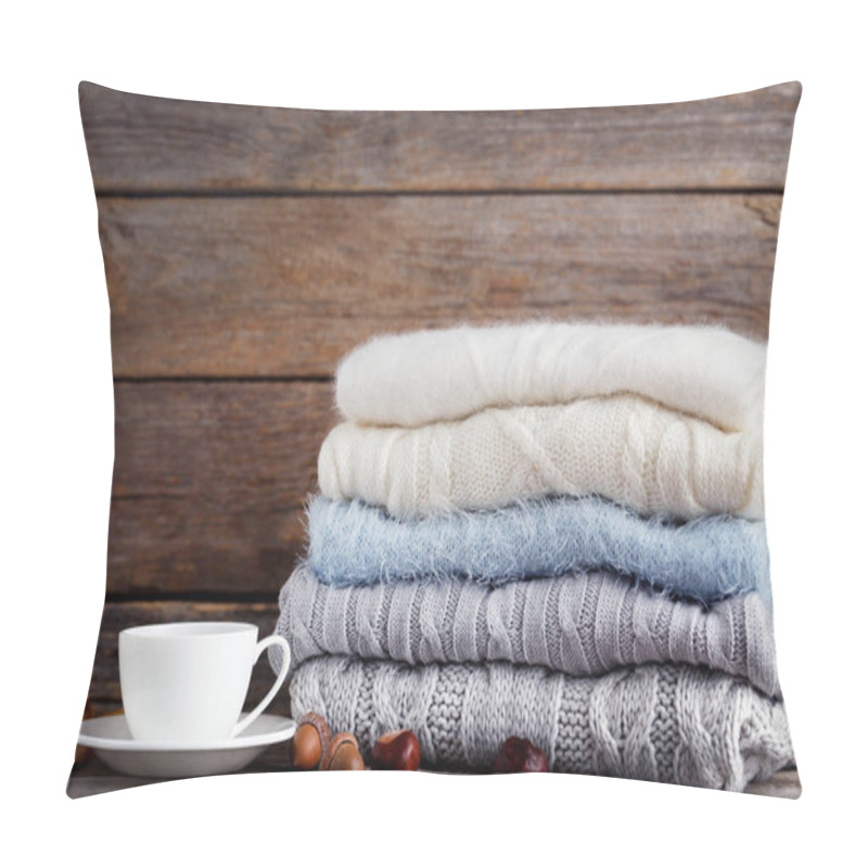 Personality  Stack Of Knitted Sweaters With Cup Of Tea, Acorns And Chestnuts On Wooden Background Pillow Covers