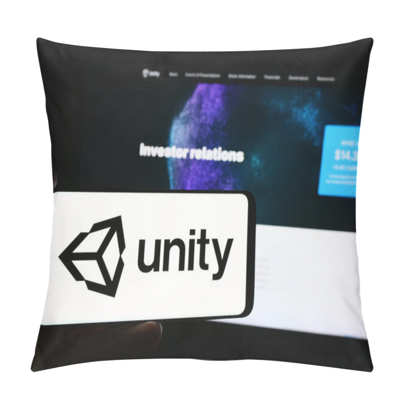 Personality  Stuttgart, Germany - 08-09-2024: Person Holding Mobile Phone With Logo Of American Video Games Company Unity Software Inc. In Front Of Business Web Page. Focus On Phone Display. Pillow Covers