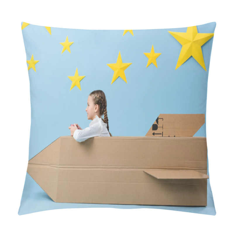 Personality  Side View Of Smiling Kid With Gamepad Sitting Near Cardboard Rocket On Blue Starry Background Pillow Covers