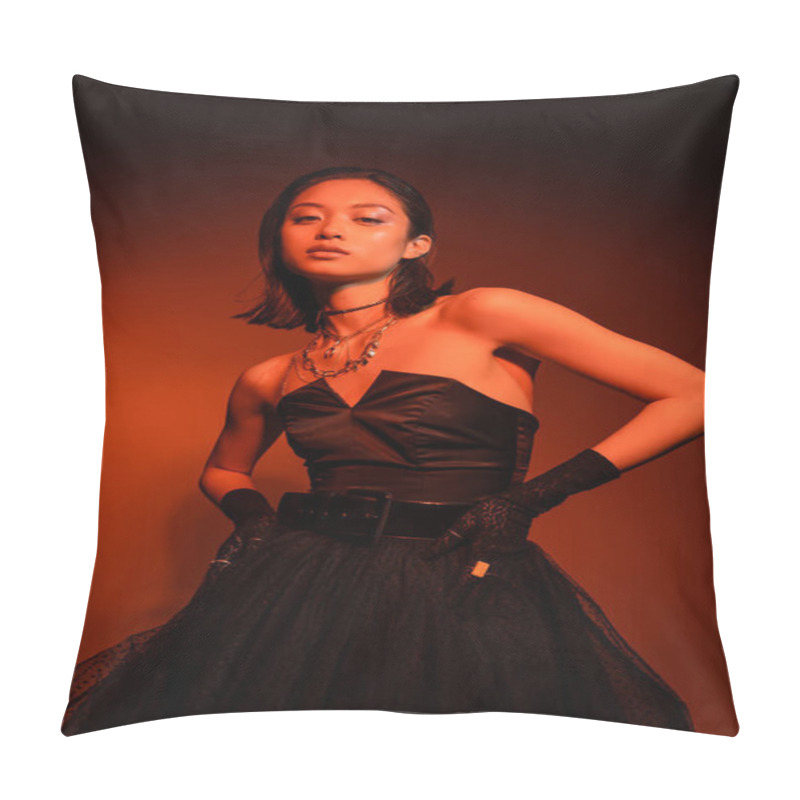 Personality  Dreamy Asian Woman With Short Hair And Wet Hairstyle Posing In Black Strapless Dress With Tulle Skirt And Gloves While Standing On Orange Background With Red Lighting, Golden Jewelry, Young Model Pillow Covers