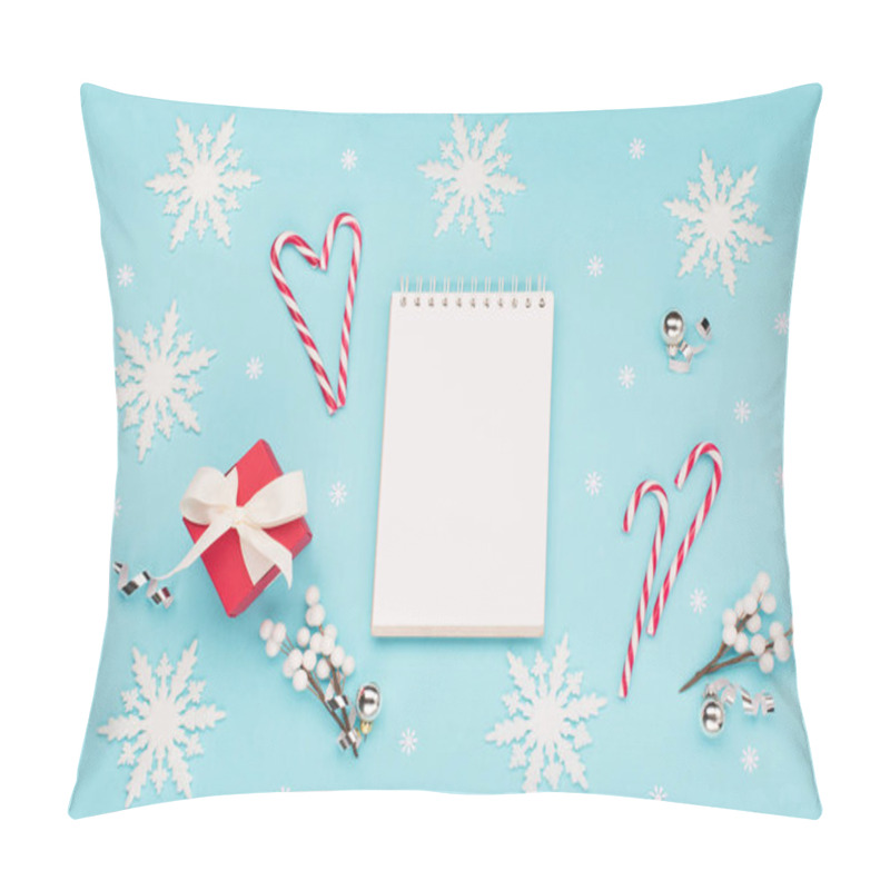 Personality  Christmas Holiday Winter New Year Festive Card. Empty White Notebook, Xmas Red Gift Box, Snowflakes, Candy Canes On Pastel Blue Background. Flat Lay, Top View, Copy Space. Pillow Covers