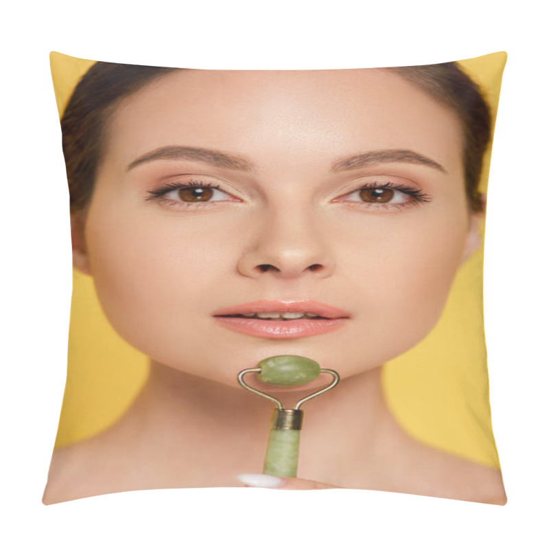 Personality  Portrait Of Beautiful Woman Using Jade Roller On Face Isolated On Yellow Pillow Covers