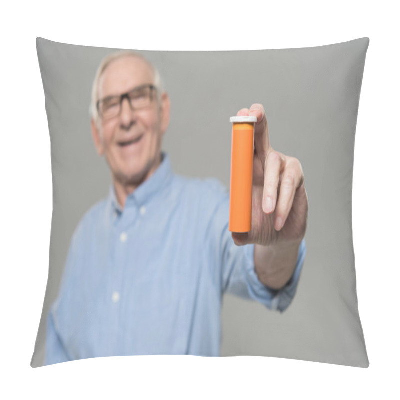 Personality  Senior Smiling Man Holds Blank Bottle Of Pills Isolated On Gray Background Pillow Covers