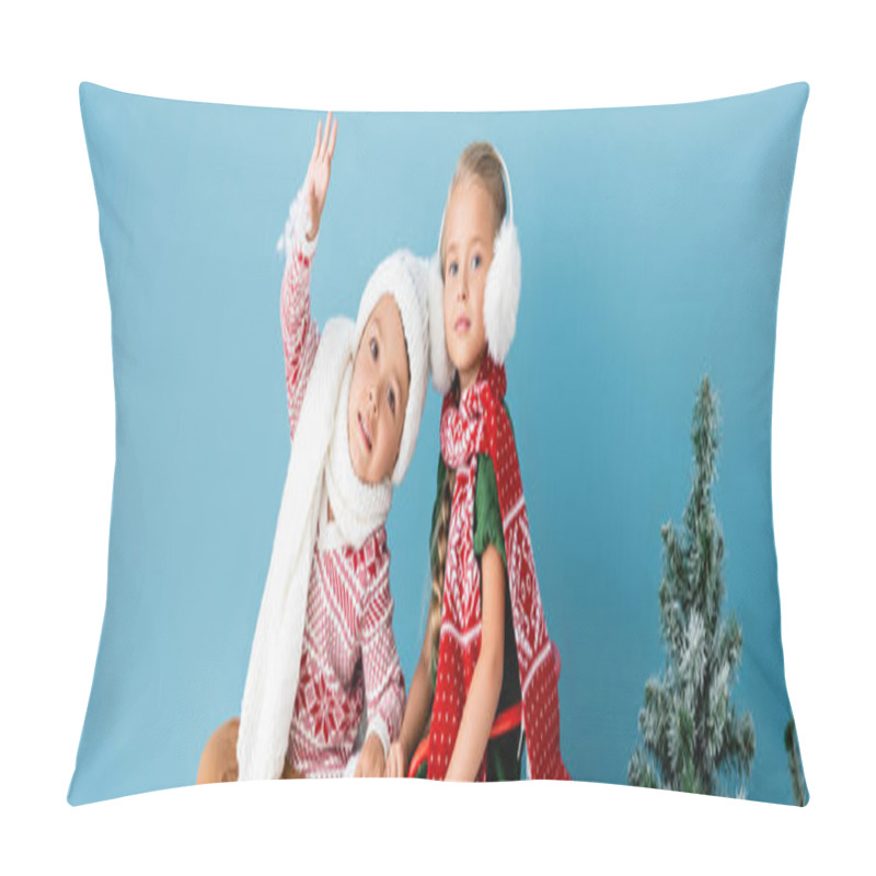 Personality  Panoramic Concept Of Boy Waving Hand Near Girl In Winter Outfit Sitting Near Pine On Blue Pillow Covers