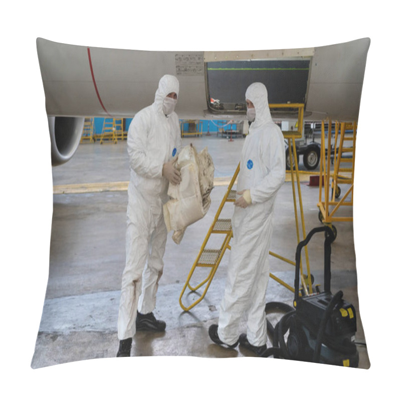 Personality  Ukraine, Kyiv - November 25, 2020: Workers Work In Medical Masks And Protective Suits During The Quarantine And The Pandemic. Working Mechanics Are Repairing The Plane. Aircraft Engine Repair. Hangar Pillow Covers