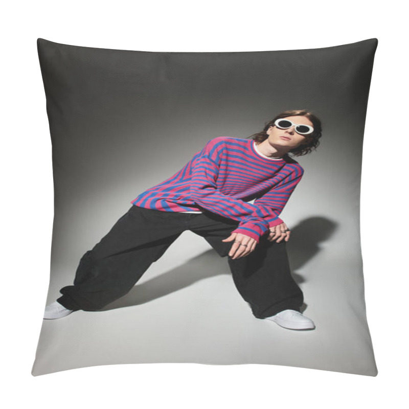 Personality  A Stylish Young Man Poses Confidently In A Vibrant Striped Sweater And Loose Trousers. Pillow Covers