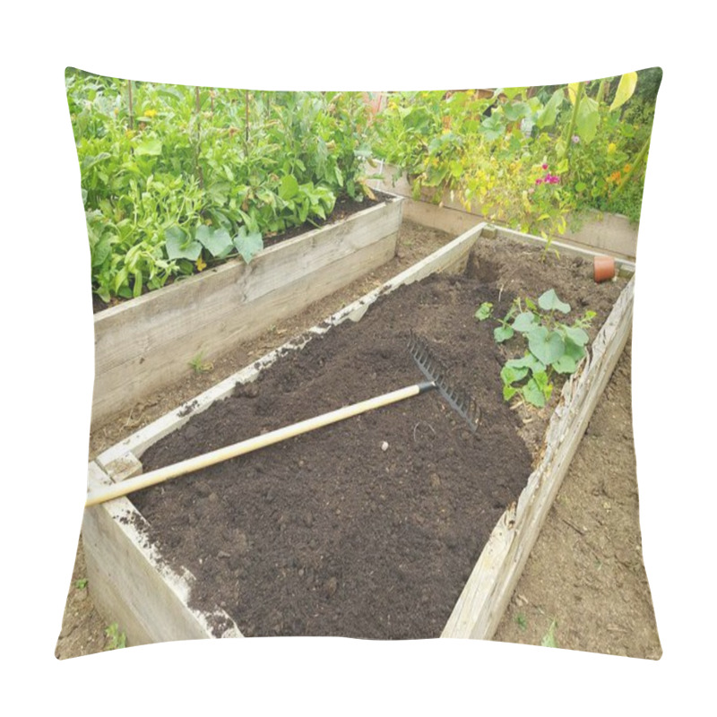 Personality  Preparing A Wooden Bed For Growing In The Backyard Garden. Rake Preparing The Soil For Planting Seeds At Home Pillow Covers