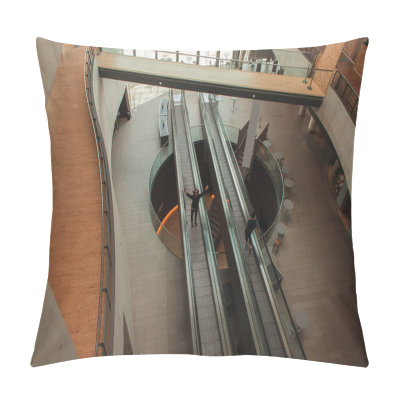 Personality  COPENHAGEN, DENMARK - APRIL 30, 2020: High Angle View Of Cheerful Man On Escalator In Black Diamond Royal Library, Copenhagen, Denmark  Pillow Covers