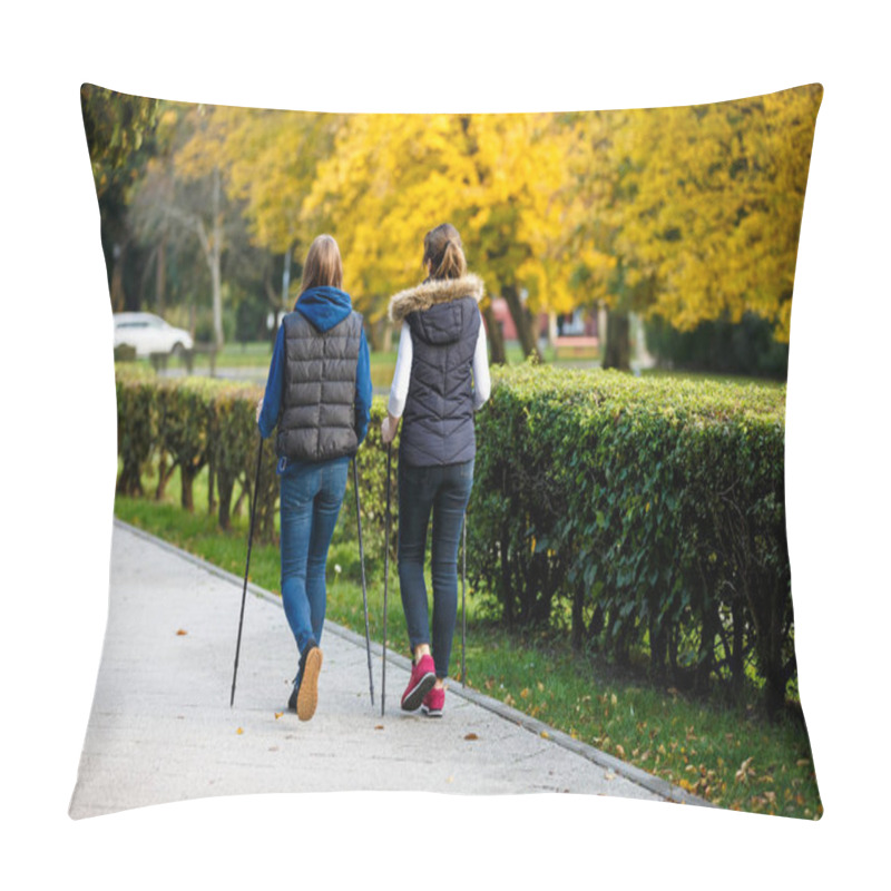 Personality  Mother And Daughter Walking Together In Autumnal Park Using Tourists Sticks - Nordic Walking. Pillow Covers