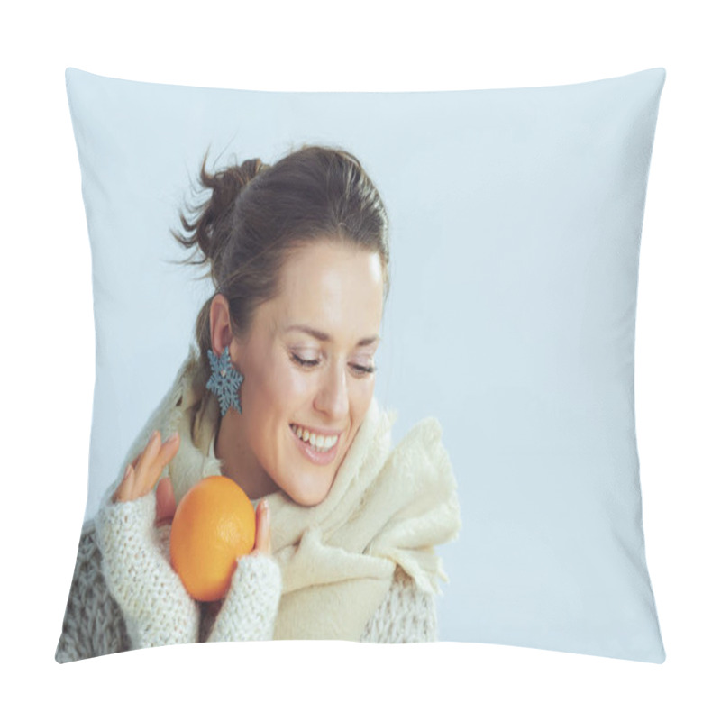 Personality  Woman Holding Orange Against Winter Light Blue Background Pillow Covers