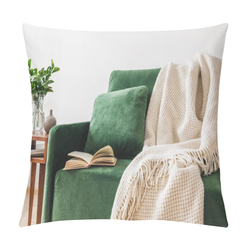 Personality  Green Sofa With Pillow, Book And Blanket Near Wooden Coffee Table With Plants  Pillow Covers