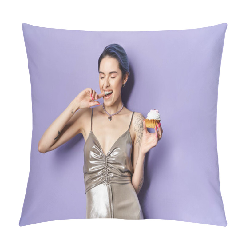 Personality  A young woman with short blue hair elegantly holds a cupcake, showcasing a silver party dress in a studio setting. pillow covers