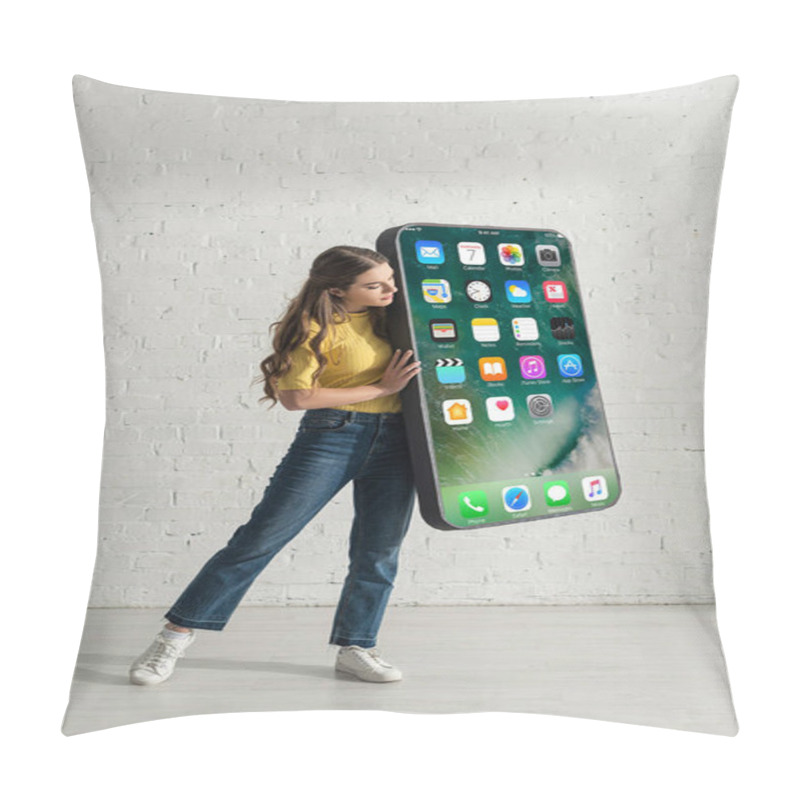 Personality  KYIV, UKRAINE - FEBRUARY 21, 2020: Attractive Girl Holding Model Of Smartphone With Iphone Screen At Home  Pillow Covers