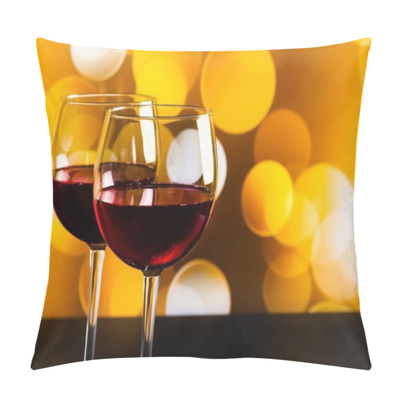 Personality  Two Red Wine Glasses On Wood Table Against Golden Bokeh Lights Background Pillow Covers