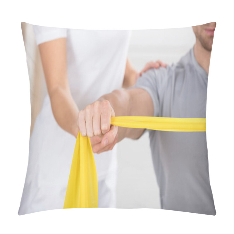 Personality  Physiotherapist Giving Training With Band Pillow Covers