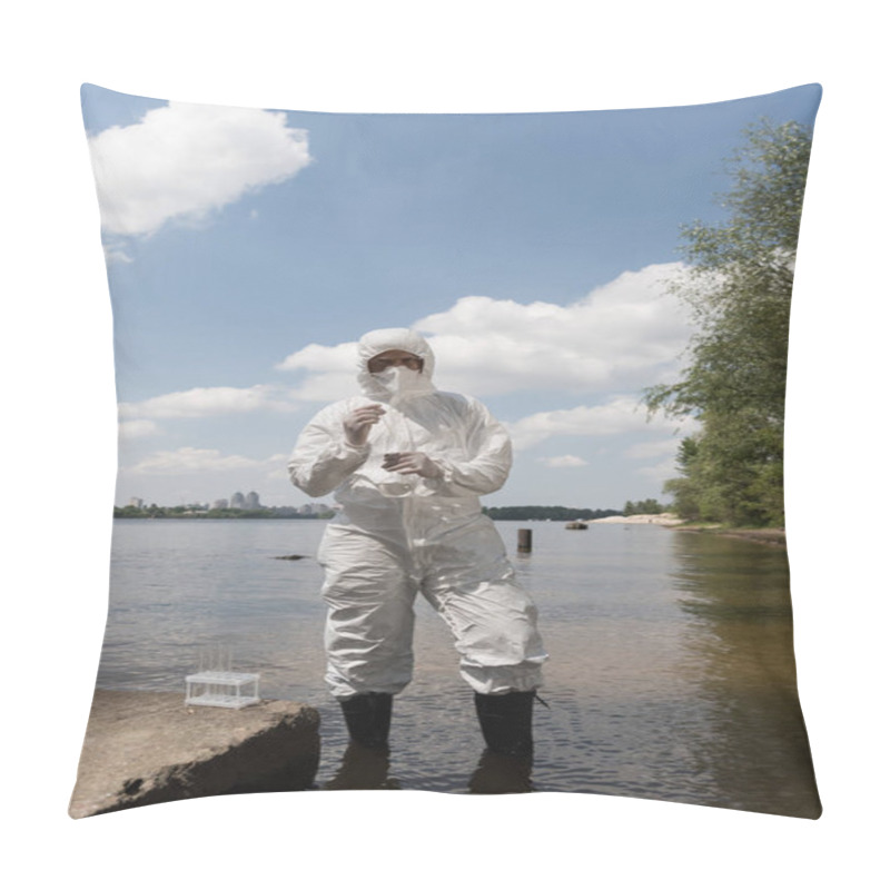 Personality  Full Length View Of Water Inspector In Protective Costume, Latex Gloves And Respirator Holding Flask With Water Sample At River Pillow Covers