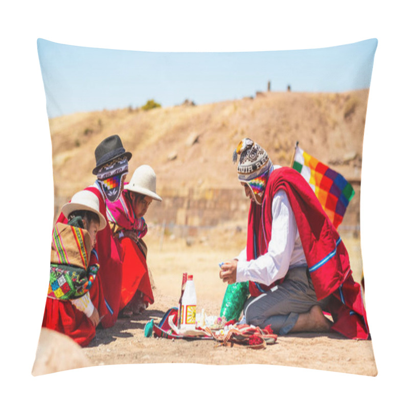 Personality  Tiwanaku, La Paz / Bolivia - September 11 2016: Young Indigenous Aymara Man In Traditional Clothing With A Wiphala Flag Is Doing A Ritual With The Coca Leaves In Front Of Children Who Are Watching Pillow Covers