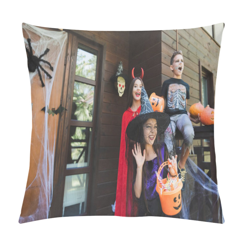 Personality  Girl In Witch Hat Waving Hand Near Excited Kids In Spooky Halloween Costumes On Porch With Decoration Pillow Covers