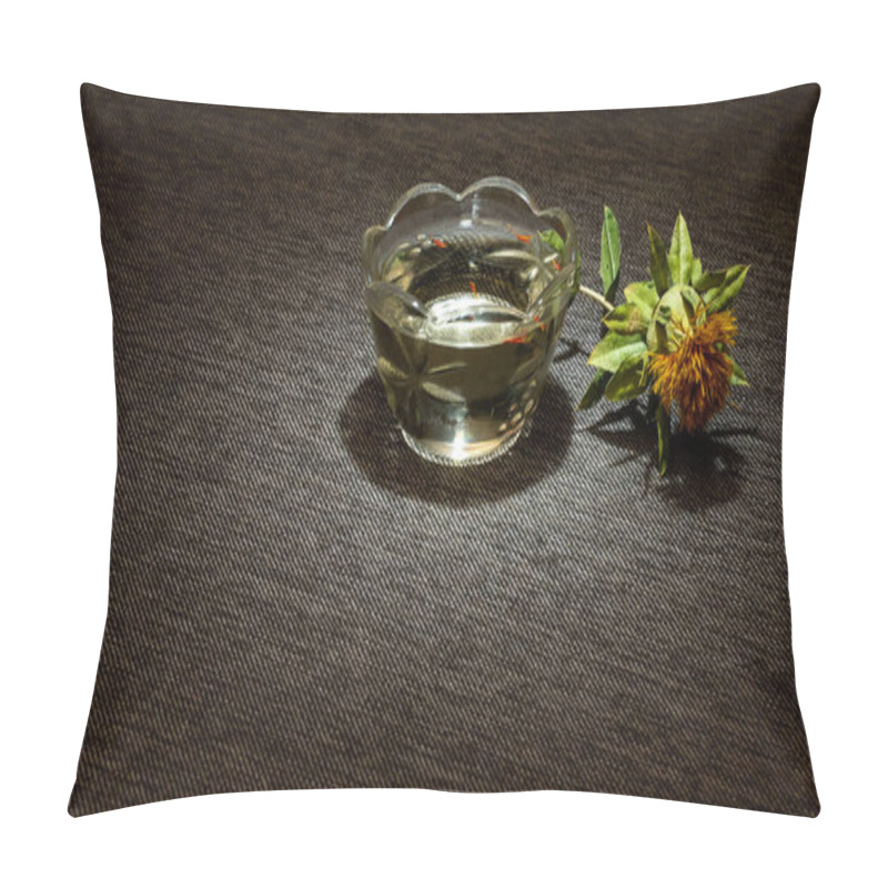 Personality  A Dried Yellow Safflower Flower Next To A Glass Cup Filled With Oil On A Dark Cloth Is Highlighted By A Spot Of Light. Carthamus Tinctorius - Oilseed And Dyeing Culture From The Times Of Ancient Egypt. Pillow Covers