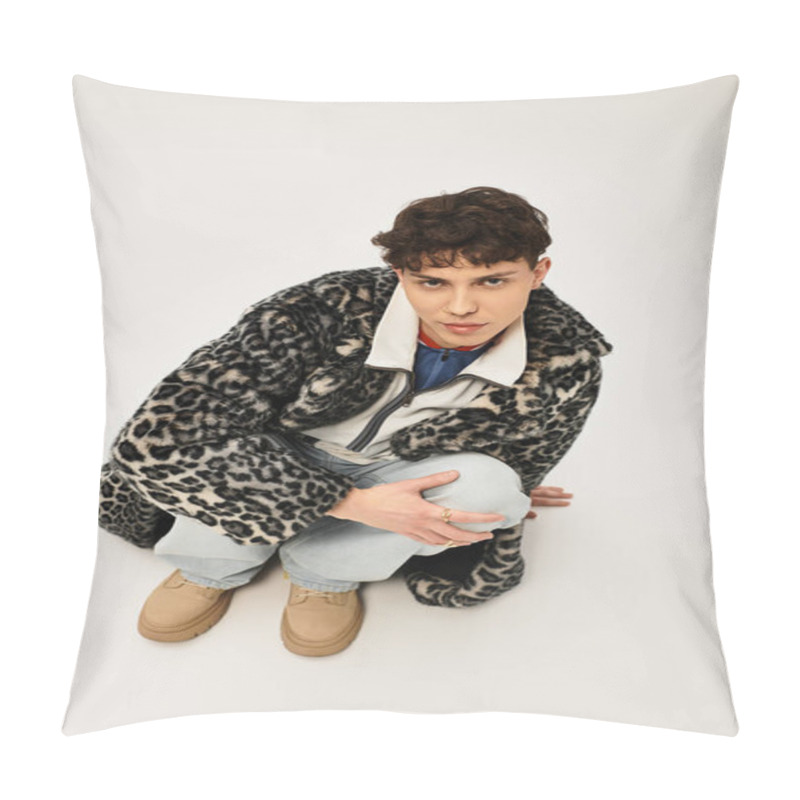 Personality  Handsome Man In Trendy Outfit Poses Thoughtfully While Crouching On A Clean Backdrop. Pillow Covers