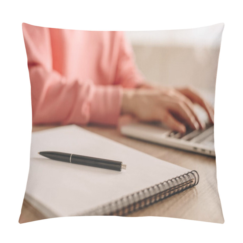 Personality  Cropped View Of Freelancer Working With Laptop Near Notebook With Pen At Table  Pillow Covers