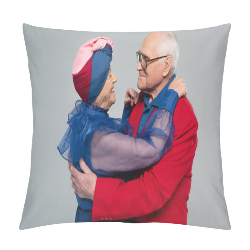 Personality  Smiling Elderly Couple In Blue Dress And Red Blazer Hugging Isolated On Grey Pillow Covers