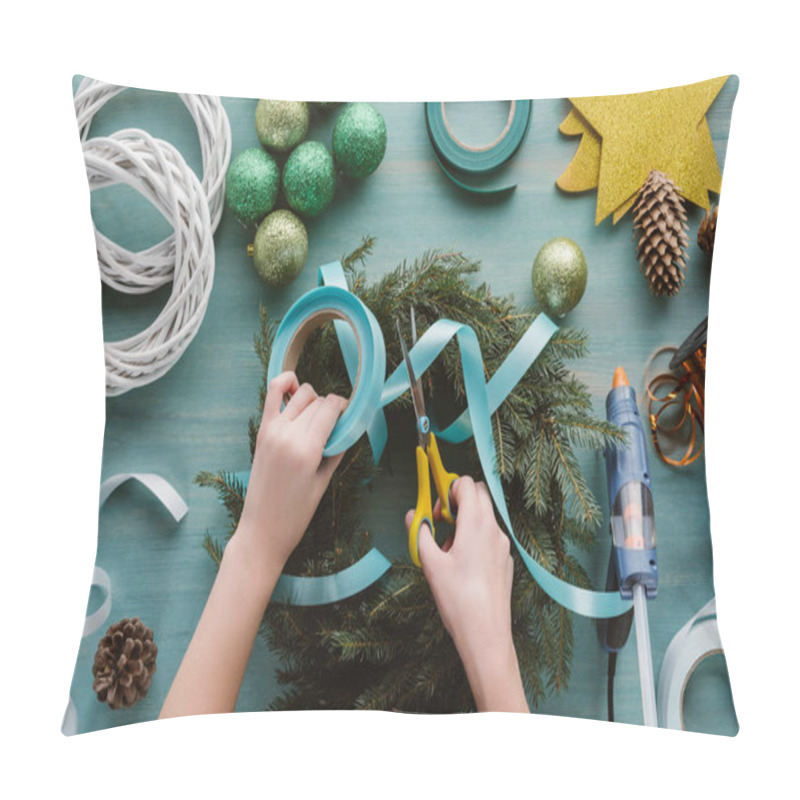 Personality  Cropped Shot Of Woman Decorating Handmade Christmas Wreath With Blue Ribbon On Blue Wooden Tabletop Pillow Covers