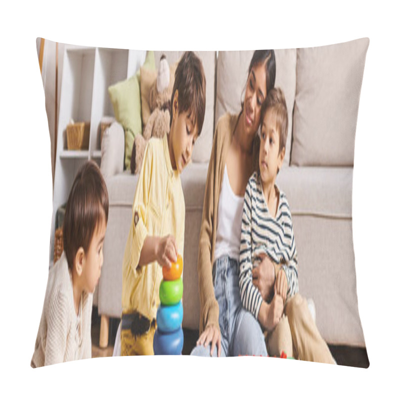 Personality  A Young Asian Mother And Her Little Sons Happily Engage In Playing With A Stacking Toy In The Living Room. Pillow Covers